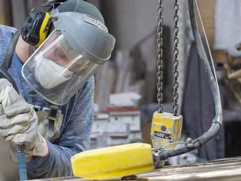 Project 12 art foundry foundry worker polishing metal 2023 11 27 04 59 24 utc