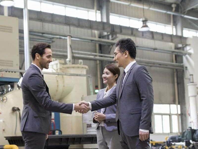 Project 4 business people shaking hands in the factory 2023 11 27 05 03 14 utc 1